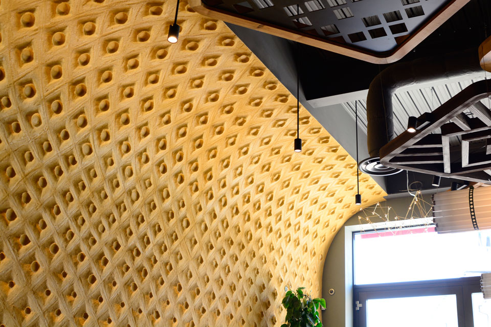 Embossed clay finish, Nando's restaurant in Hereford, photographer James Parsons