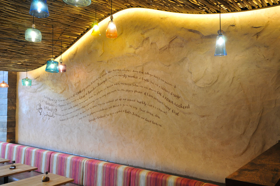Undulated clay finish, Nando's restaurant in Nottingham Market Square, photographer James Parsons