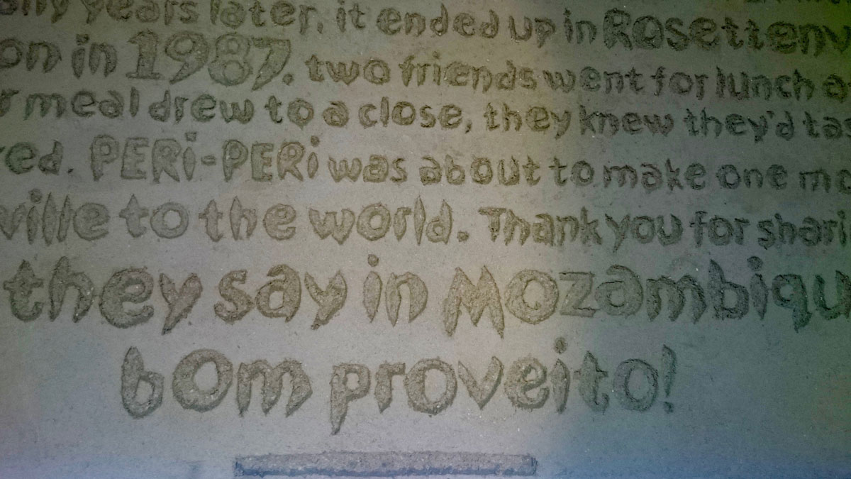 Carved clay wall by Guy Valentine at Nando's Stafford.