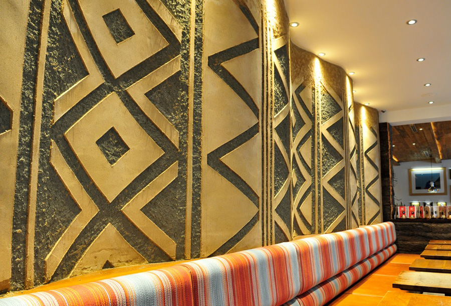 Carved clay wall, geometric pattern, Nando's restaurant in Gloucester