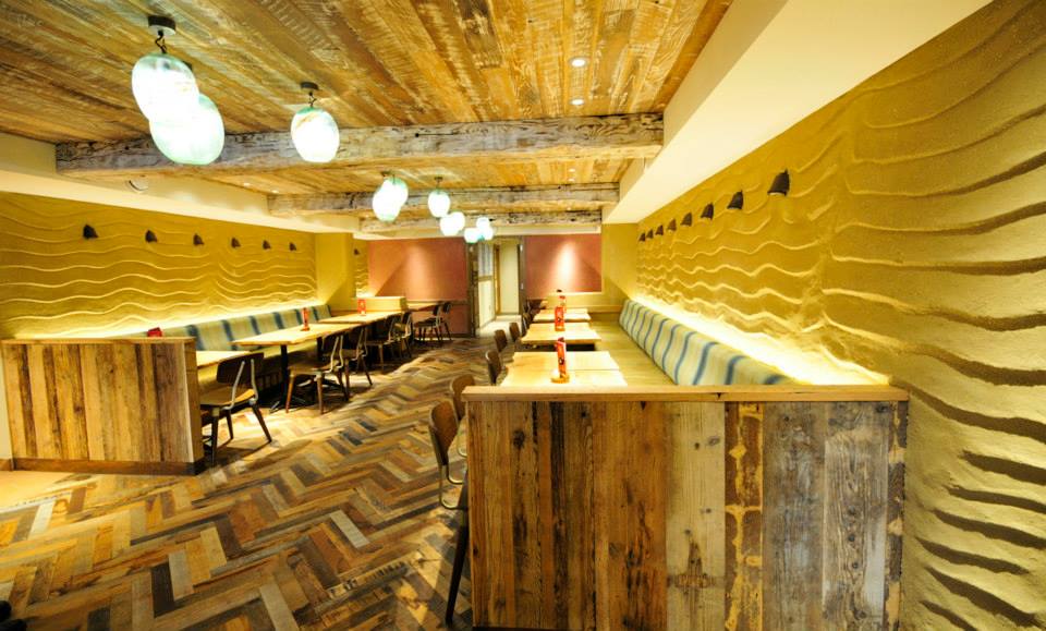 Undulated clay finish, Nando's restaurant in Dublin, Ireland