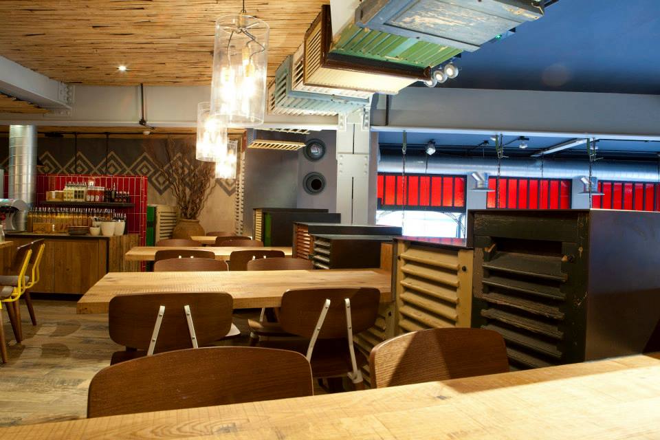 Anaglyptic two tone clay textured wall, Nando's restaurant in Glasgow