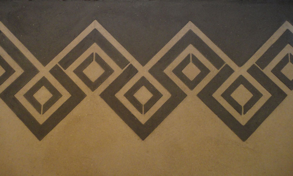 Anaglyptic two tone clay textured wall, Nando's restaurant in Glasgow