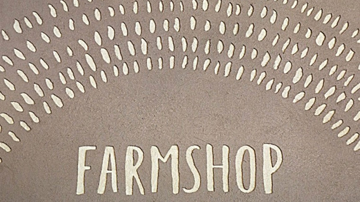 Carved clay wall by Guy Valentine at Gloucester Services.