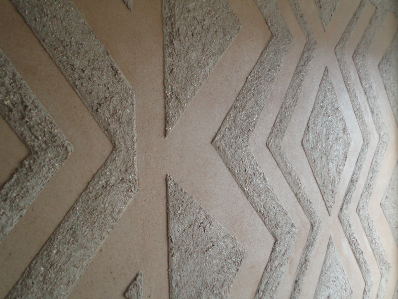 Anaglyptic two tone clay textured wall, Nando's restaurant in Liverpool