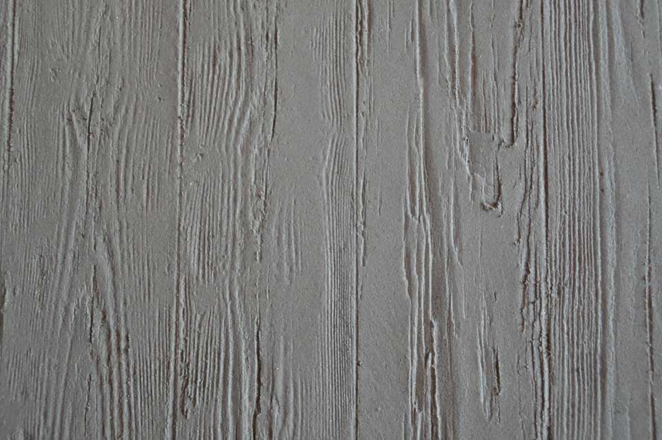 Board-marked clay finish, wood textured large interior clay wall, Nando's restaurant in Milton Keynes