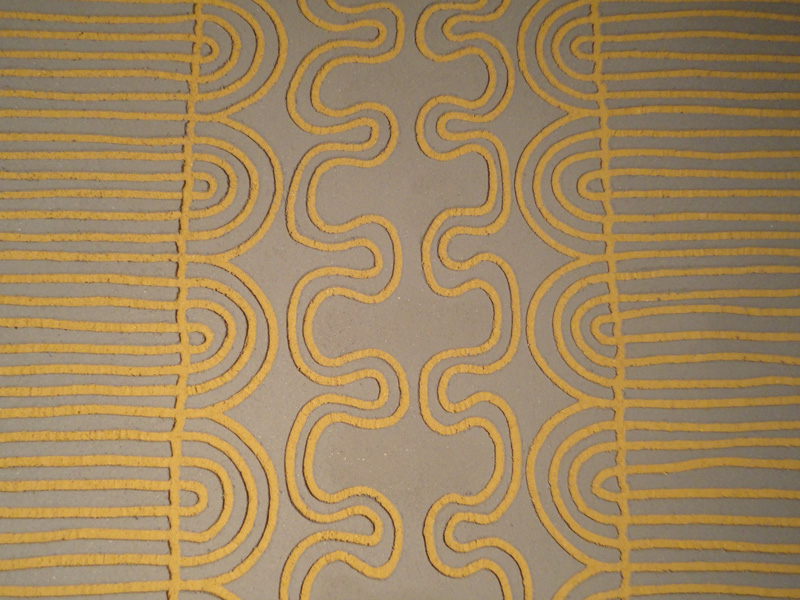 Carved clay wall, African inspired pattern, Nando's restaurant in Redditch