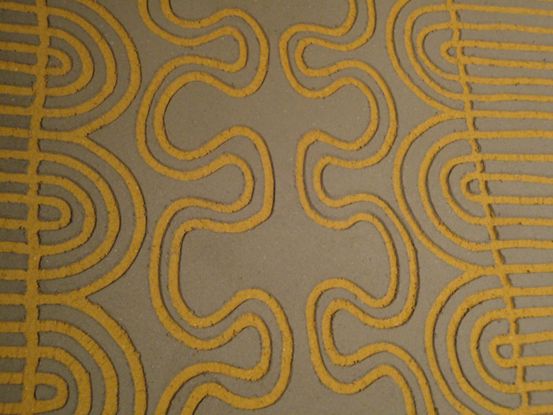 Carved clay wall, African inspired pattern, Nando's restaurant in Redditch