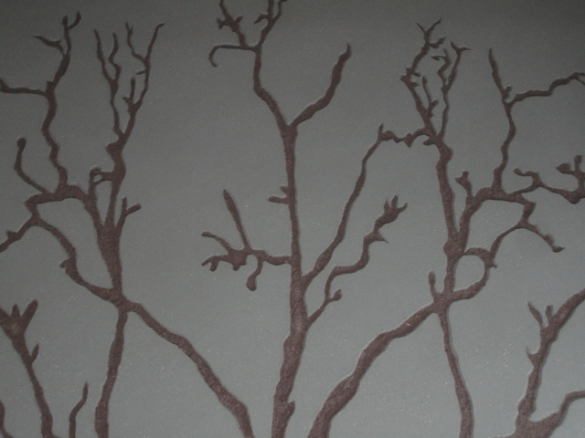 Carved clay wall, tree image, Nando's restaurant in Staines